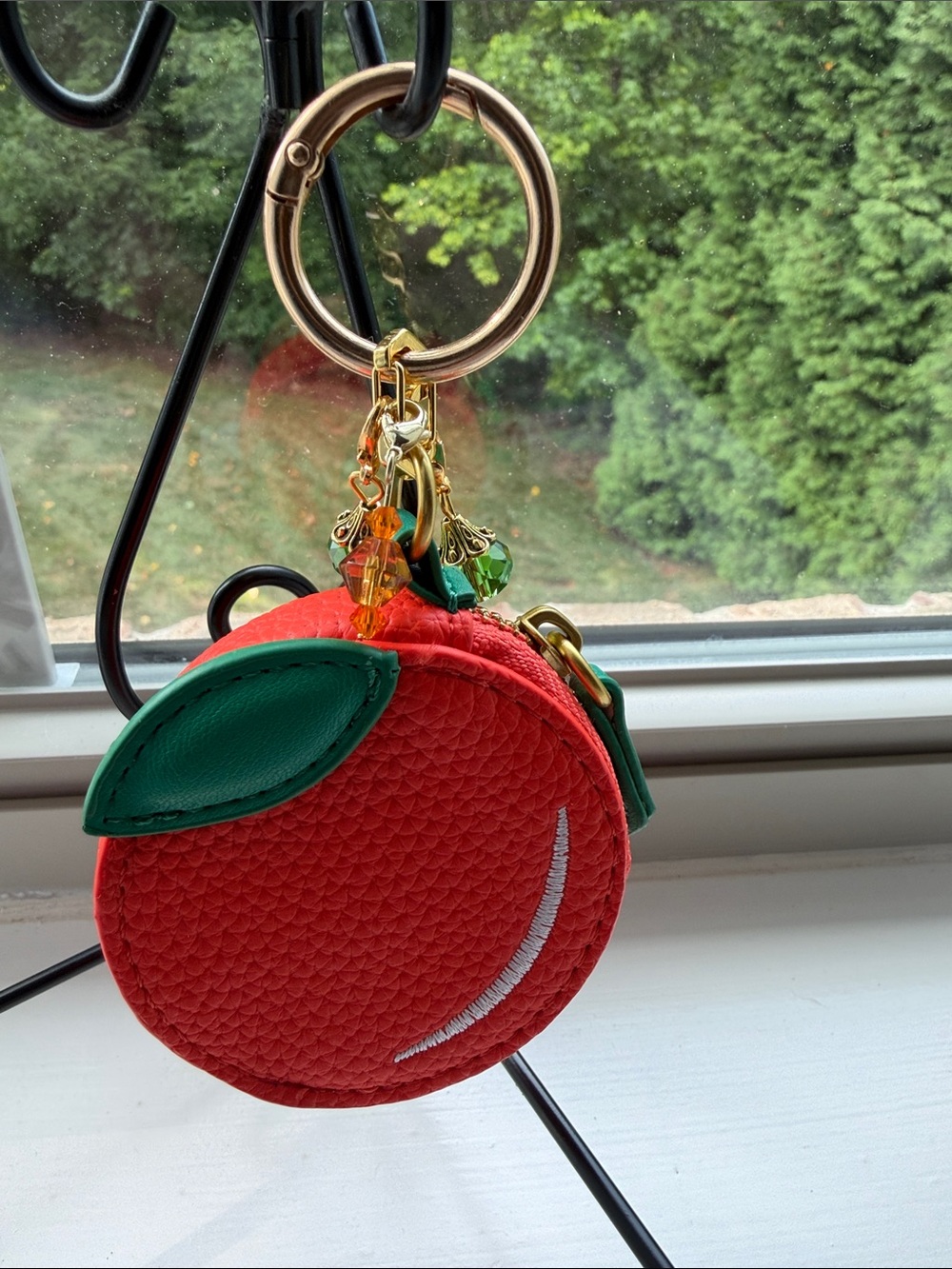 Orange Fruit-Shaped Coin Purse Keychain with Green Leaf and crystal Accents.